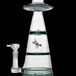 Clear glass water pipe shaped like a UFO with a cowboy graphic inside.