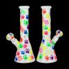 Two colorful glass bongs with patterned designs against a black background.