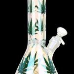 Glass bong with cannabis leaf patterns and iridescent finish.