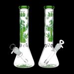 Two glass bongs with green cannabis leaf designs.