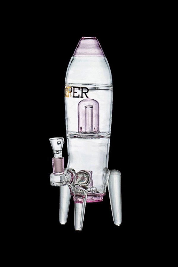 Glass rocket ship-shaped water pipe with pink accents, isolated on a black background.