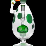 Green and white patterned glass water pipe (bong) with unique sculptural design.