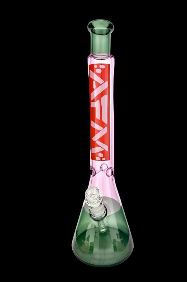 Green and pink glass bong with intricate designs, isolated on a black background.