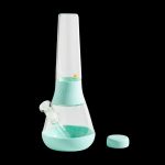 Mint green glass bong with silicone accents and cap, isolated on a black background.