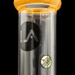 A sleek, black glass water pipe with a rounded amber mouthpiece, branded with a stylized "LA" logo and "Made in USA".