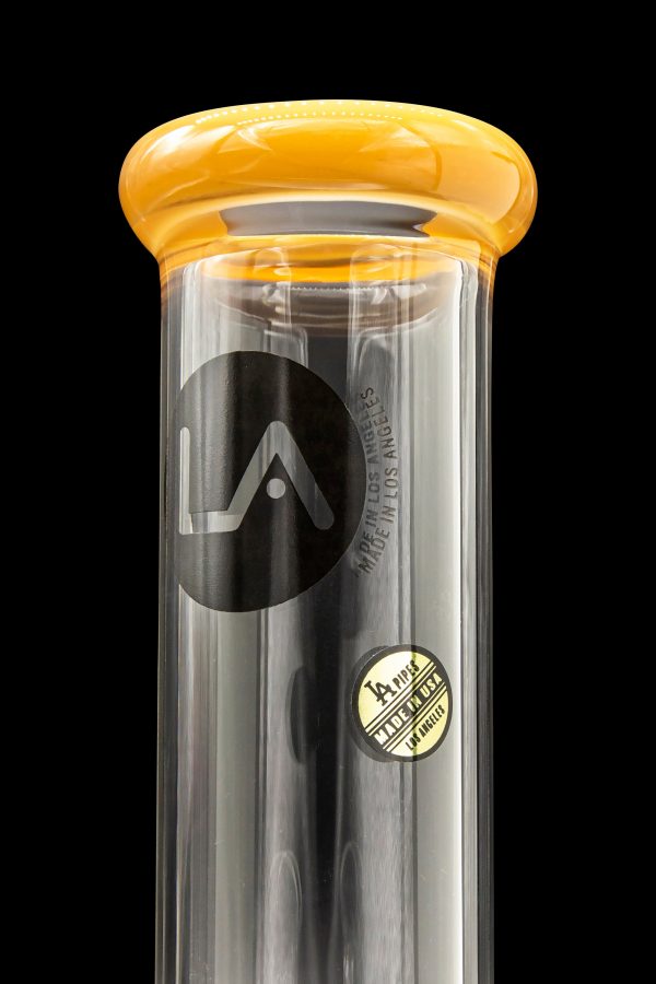 A sleek, black glass water pipe with a rounded amber mouthpiece, branded with a stylized "LA" logo and "Made in USA".